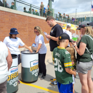 fans getting partnership merchandise (sunglasses, water bottle)